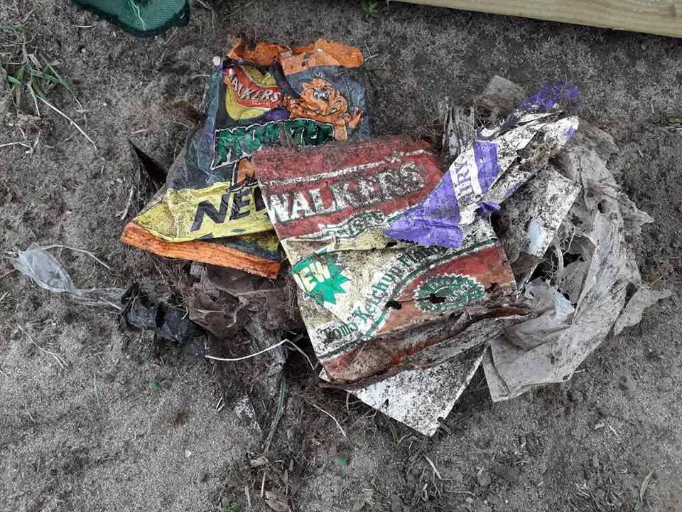 A crisp packet that was eaten in 1994 and has been in the environment without decomposing.